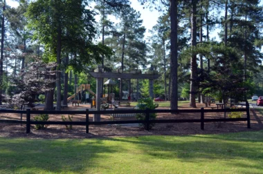 Coronado aluminum post and rail fence around play ground