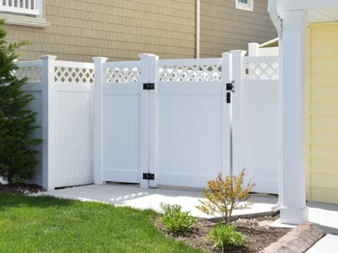 white vinyl lattice top privacy fence with gate